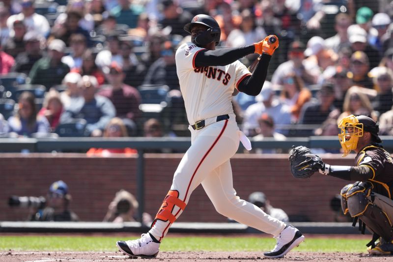 Apr 7, 2024; San Francisco, California, USA; San Francisco Giants designated hitter Jorge Soler (2) hits a double against the San Diego Padres during the first inning at Oracle Park. Mandatory Credit: Darren Yamashita-USA TODAY Sports