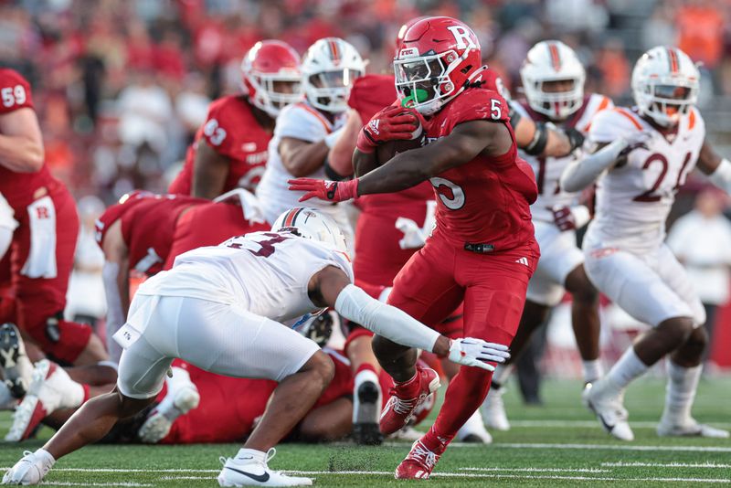 Sep 16, 2023; Piscataway, New Jersey, USA; Rutgers Scarlet Knights running back Kyle Monangai (5) carries the ball as Virginia Tech Hokies cornerback Derrick Canteen (13) tackles during the second half at SHI Stadium. Mandatory Credit: Vincent Carchietta-USA TODAY Sports