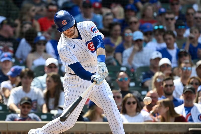 Jun 15, 2024; Chicago, Illinois, USA;  Chicago Cubs outfielder Ian Happ (8) hits a three run home run against the St. Louis Cardinals during the seventh inning at Wrigley Field. Mandatory Credit: Matt Marton-USA TODAY Sports