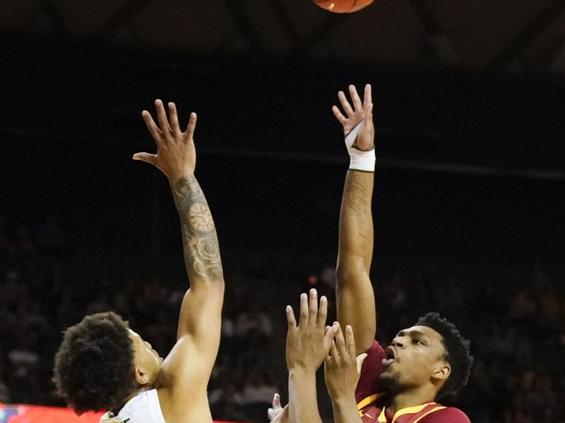 Mar 4, 2023; Waco, Texas, USA; Iowa State Cyclones center Osun Osunniyi (21) shoots over Baylor Bears guard Keyonte George (1) during the first half at Ferrell Center. Mandatory Credit: Raymond Carlin III-USA TODAY Sports