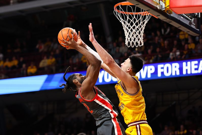 Feb 22, 2024; Minneapolis, Minnesota, USA; Ohio State Buckeyes guard Evan Mahaffey (12) shoots as Minnesota Golden Gophers forward Dawson Garcia (3) defends during the second half at Williams Arena. Mandatory Credit: Matt Krohn-USA TODAY Sports