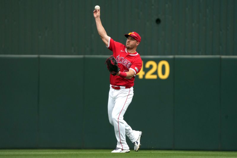 Mar 5, 2025; Tempe, Arizona, USA; Los Angeles Angels outfielder Mike Trout (27) makes the play for an out against the Los Angeles Dodgers in the third inning at Tempe Diablo Stadium. Mandatory Credit: Rick Scuteri-Imagn Images