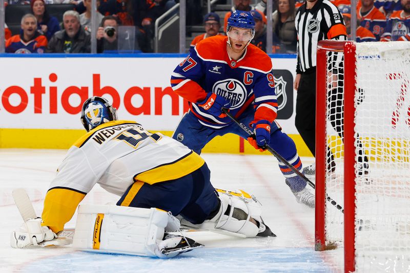 Nov 14, 2024; Edmonton, Alberta, CAN; Nashville Predators goaltender Scott Wedgwood (41) makes a save on Edmonton Oilers forward Connor McDavid (97) during the first period at Rogers Place. Mandatory Credit: Perry Nelson-Imagn Images