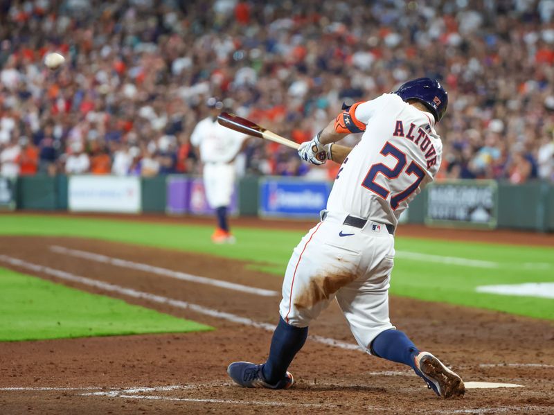 Apr 13, 2024; Houston, Texas, USA; Houston Astros second base Jose Altuve (27) hits a two-run RBI double against the Texas Rangers in the seventh inning at Minute Maid Park. Mandatory Credit: Thomas Shea-USA TODAY Sports