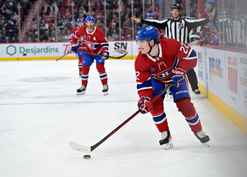 Apr 6, 2024; Montreal, Quebec, CAN; Montreal Canadiens forward Cole Caufield (22) plays the puck during the third period of the game against the Toronto Maple Leafs at the Bell Centre. Mandatory Credit: Eric Bolte-USA TODAY Sports