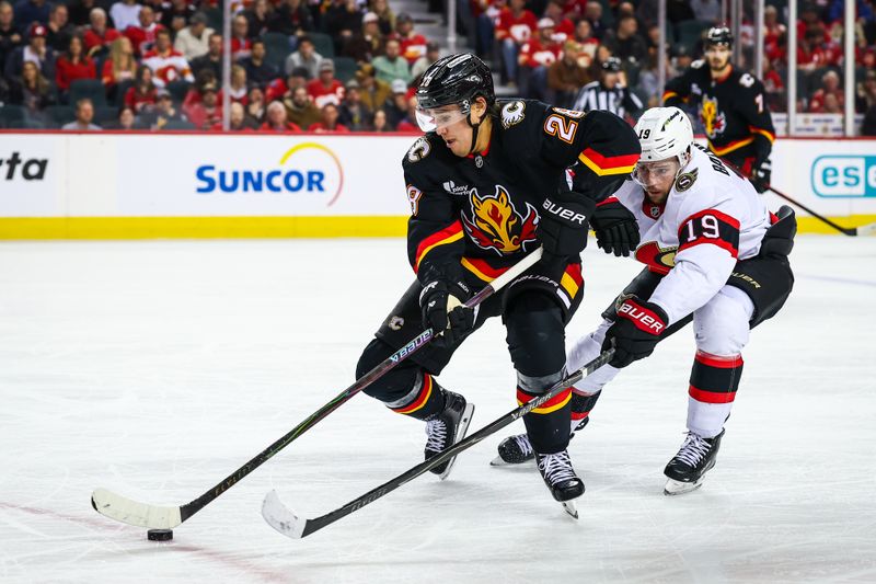 Mar 5, 2026; Calgary, Alberta, CAN; Calgary Flames defenseman Zach Whitecloud (28) controls the puck against Ottawa Senators right wing Drake Batherson (19) during the third period at Scotiabank Saddledome. Mandatory Credit: Sergei Belski-Imagn Images