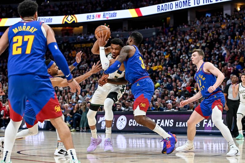 DENVER, CO - MARCH 25:  Giannis Antetokounmpo #34 of the Milwaukee Bucks is defended by Jeff Green #32 of the Denver Nuggets in the second half of a game at Ball Arena on March 25, 2023 in Denver, Colorado. NOTE TO USER: User expressly acknowledges and agrees that, by downloading and or using this photograph, User is consenting to the terms and conditions of the Getty Images License Agreement. (Photo by Dustin Bradford/Getty Images)