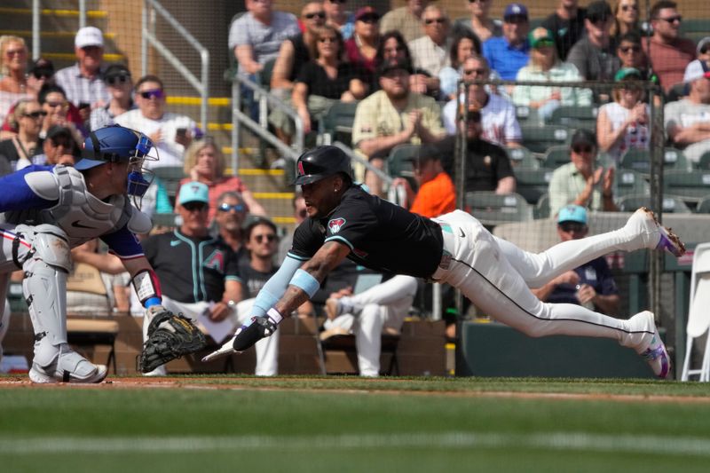 Feb 27, 2024; Salt River Pima-Maricopa, Arizona, USA; Arizona Diamondbacks second baseman Ketel Marte (4) scores a run under the tag by Texas Rangers catcher Andrew Knapp during the first inning at Salt River Fields at Talking Stick. Mandatory Credit: Rick Scuteri-USA TODAY Sports