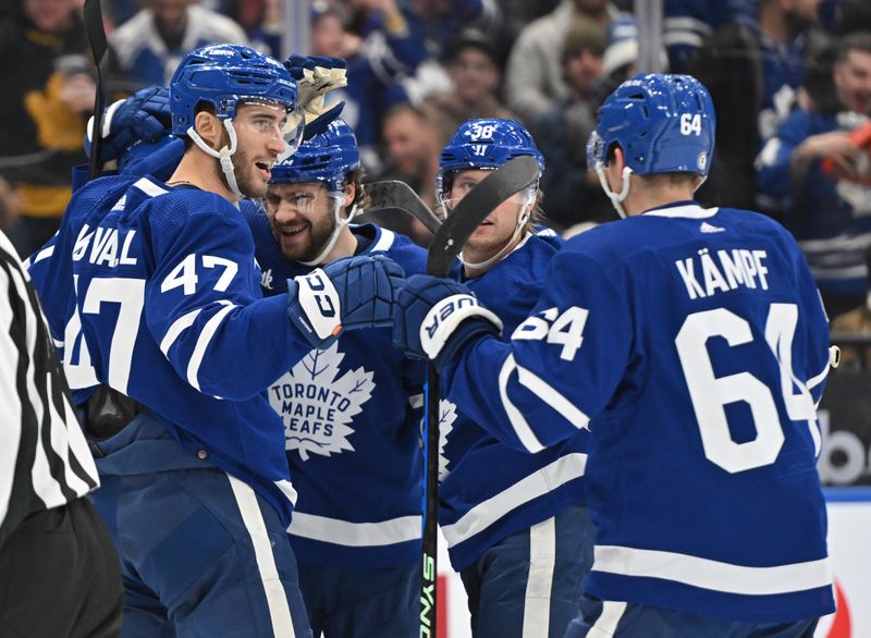 Jan 3, 2023; Toronto, Ontario, CAN; Toronto Maple Leafs forward Pierre Engvall (47) celebrates with teammates after scoring against the St. Louis Blues in the first period at Scotiabank Arena. Mandatory Credit: Dan Hamilton-USA TODAY Sports