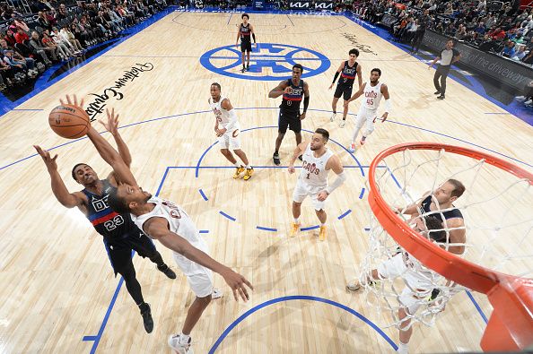 DETROIT, MI - DECEMBER 2: Evan Mobley #4 of the Cleveland Cavaliers grabs the rebound during the game  on December 2, 2023 at Little Caesars Arena in Detroit, Michigan. NOTE TO USER: User expressly acknowledges and agrees that, by downloading and/or using this photograph, User is consenting to the terms and conditions of the Getty Images License Agreement. Mandatory Copyright Notice: Copyright 2023 NBAE (Photo by Chris Schwegler/NBAE via Getty Images)