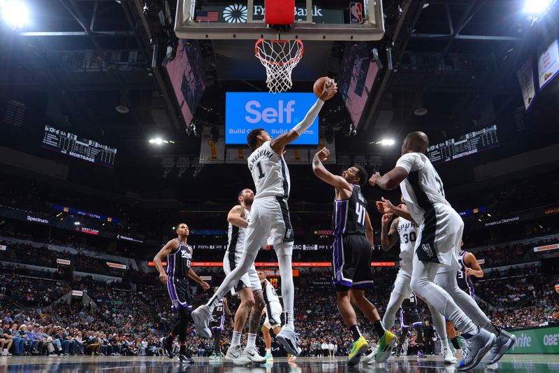 SAN ANTONIO, TX - NOVEMBER 11:  Victor Wembanyama #1 of the San Antonio Spurs grabs the rebound during the game against the Sacramento Kings  during a regular season game on November 11, 2024 at the Frost Bank Center in San Antonio, Texas. NOTE TO USER: User expressly acknowledges and agrees that, by downloading and or using this photograph, user is consenting to the terms and conditions of the Getty Images License Agreement. Mandatory Copyright Notice: Copyright 2024 NBAE (Photos by Michael Gonzales/NBAE via Getty Images)