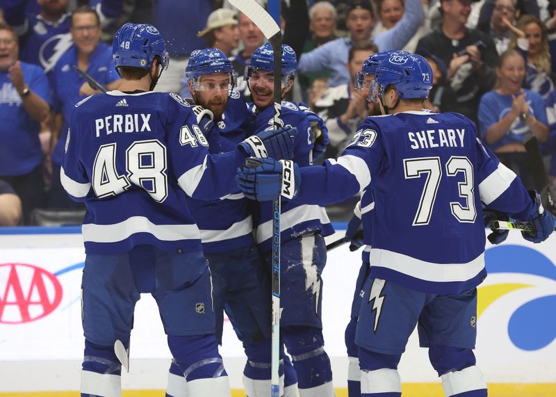 Oct 26, 2023; Tampa, Florida, USA; Tampa Bay Lightning center Michael Eyssimont (23) is congratulated after he scored a goal against the San Jose Sharks during the first period at Amalie Arena. Mandatory Credit: Kim Klement Neitzel-USA TODAY Sports