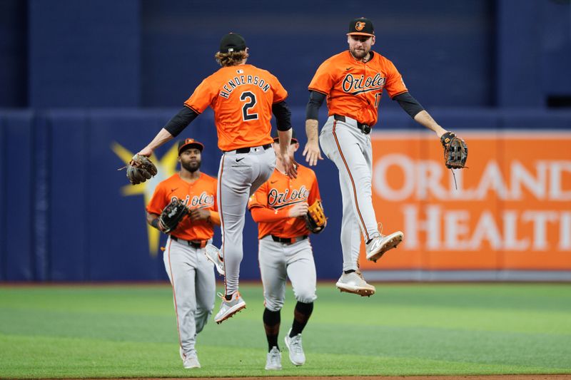 Jun 8, 2024; St. Petersburg, Florida, USA;  Baltimore Orioles outfielder Colton Cowser (17) and shortstop Gunnar Henderson (2) celebrate after beating the Tampa Bay Rays at Tropicana Field. Mandatory Credit: Nathan Ray Seebeck-USA TODAY Sports