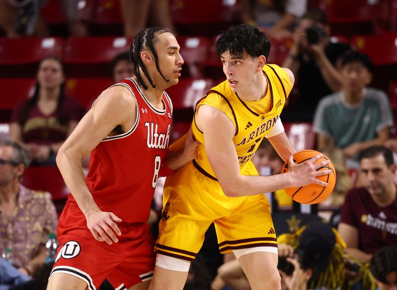 Feb 28, 2026; Tempe, Arizona, USA; Arizona State Sun Devils forward Santiago Trouet (1) controls the ball against Utah Utes forward Keanu Dawes (8) in the first half at Desert Financial Arena. Mandatory Credit: Mark J. Rebilas-Imagn Images