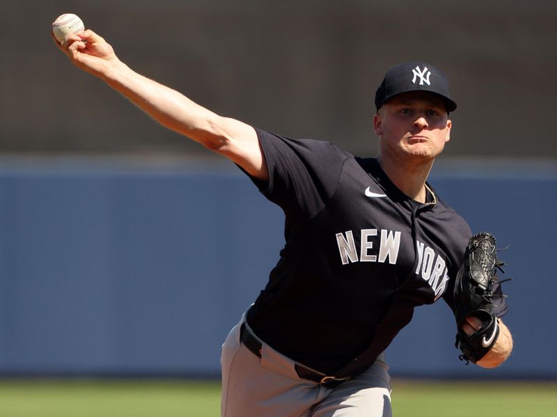 Feb 27, 2024; Port Charlotte, Florida, USA;  New York Yankees starting pitcher Clarke Schmidt (36) throws a pitch during the first inning against the Tampa Bay Rays at Charlotte Sports Park. Mandatory Credit: Kim Klement Neitzel-USA TODAY Sports