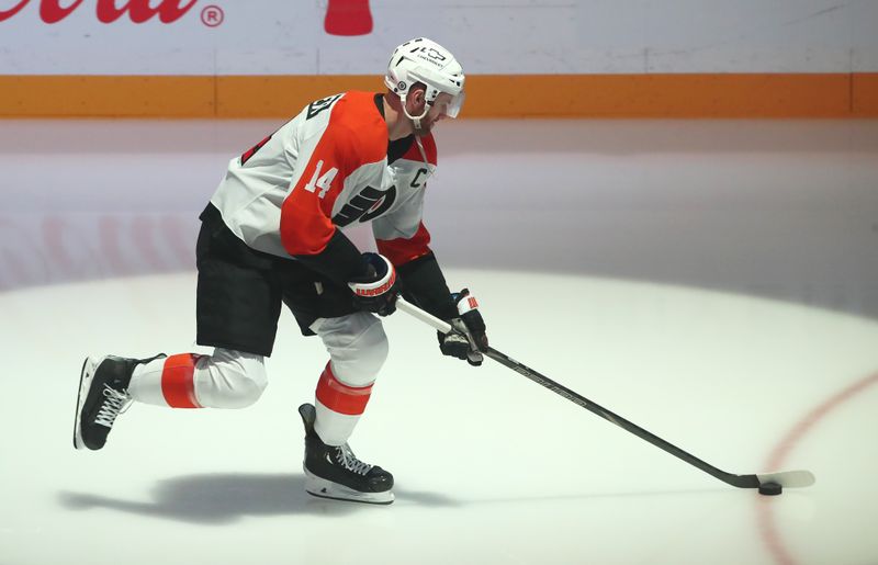 Feb 27, 2025; Pittsburgh, Pennsylvania, USA;  Philadelphia Flyers center Sean Couturier (14) takes the ice to warm up against the Pittsburgh Penguins at PPG Paints Arena. Mandatory Credit: Charles LeClaire-Imagn Images