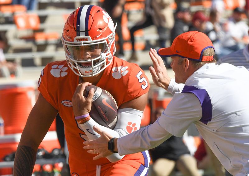 Nov 26, 2022; Clemson, SC, USA; Clemson quarterback D.J. Uiagalelei (5) warms up with Clemson offensive coordinator Brandon Streeter before the game between South Carolina and Clemson at Memorial Stadium in Clemson, S.C. Saturday, Nov. 26, 2022.    Mandatory Credit: Ken Ruinard-USA TODAY Sports