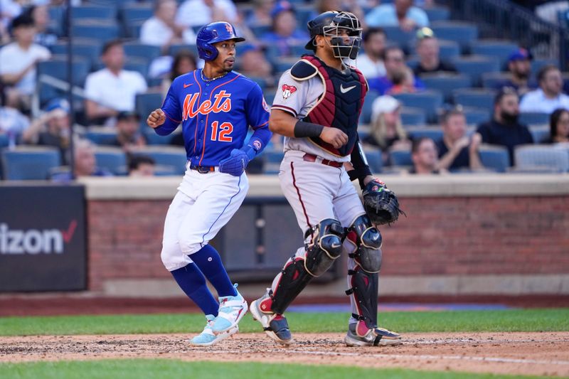 Sep 14, 2023; New York City, New York, USA; New York Mets shortstop Francisco Lindor (12) scores a run on a RBI single hit by New York Mets right Fielder DJ Steward (not pictured) against the Arizona Diamondbacks during the fifth inning at Citi Field. Mandatory Credit: Gregory Fisher-USA TODAY Sports