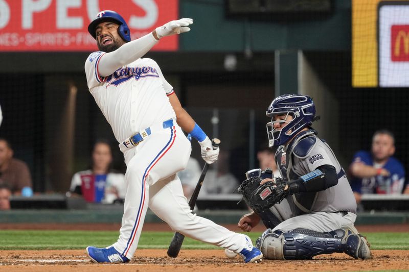 Sep 3, 2024; Arlington, Texas, USA; Texas Rangers left fielder Ezequiel Duran (20) reacts to a foul off his foot during the fifth inning against the New York Yankees at Globe Life Field. Mandatory Credit: Jim Cowsert-Imagn Images