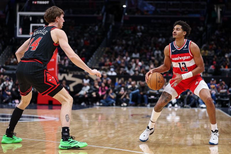 WASHINGTON, DC - JANUARY 01: Jordan Poole #13 of the Washington Wizards brings the ball up court against Matas Buzelis #14 of the Chicago Bulls during the second half at Capital One Arena on January 1, 2025 in Washington, DC. NOTE TO USER: User expressly acknowledges and agrees that, by downloading and or using this photograph, User is consenting to the terms and conditions of the Getty Images License Agreement. (Photo by Scott Taetsch/Getty Images)