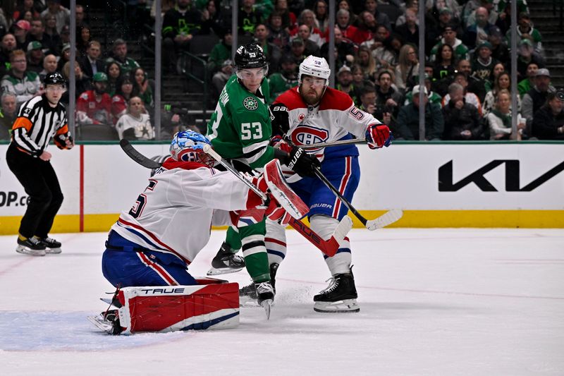 Jan 16, 2025; Dallas, Texas, USA; Dallas Stars center Wyatt Johnston (53) attempts to redirect the puck past Montreal Canadiens goaltender Jakub Dobes (75) as defenseman David Savard (58) looks on during the second period at the American Airlines Center. Mandatory Credit: Jerome Miron-Imagn Images