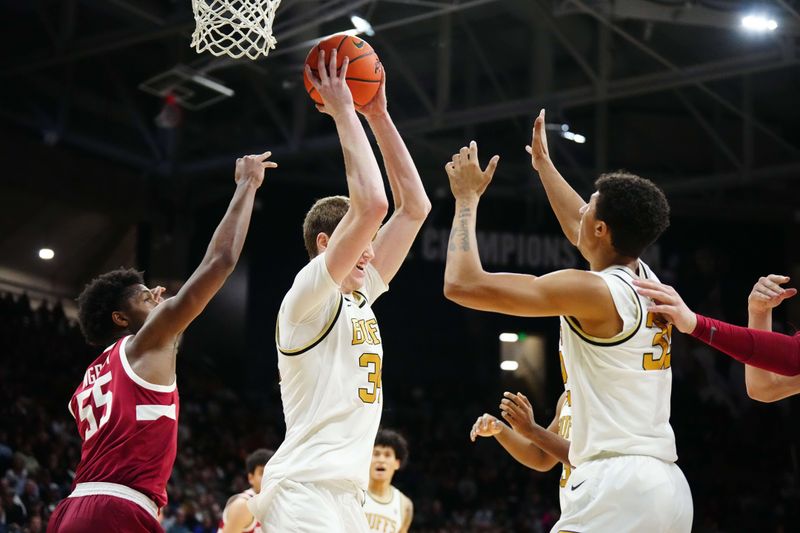 Feb 5, 2023; Boulder, Colorado, USA; Colorado Buffaloes center Lawson Lovering (34) pulls in a rebound away from Stanford Cardinal forward Harrison Ingram (55) in the second half at the CU Events Center. Mandatory Credit: Ron Chenoy-USA TODAY Sports