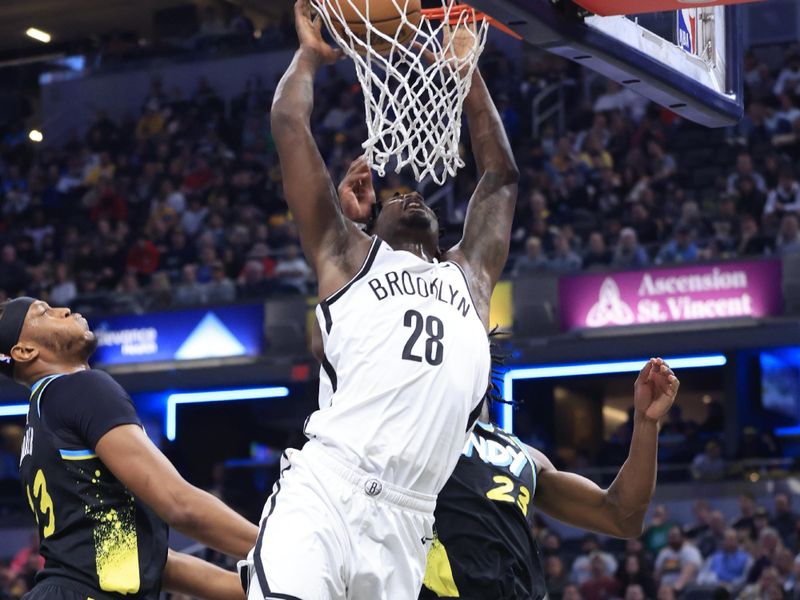 INDIANAPOLIS, INDIANA - MARCH 16: Dorian Finney-Smith #28 of the Brooklyn Nets dunks the ball in the game against the Indiana Pacers during the first half at Gainbridge Fieldhouse on March 16, 2024 in Indianapolis, Indiana. NOTE TO USER: User expressly acknowledges and agrees that, by downloading and or using this photograph, User is consenting to the terms and conditions of the Getty Images License Agreement. (Photo by Justin Casterline/Getty Images)