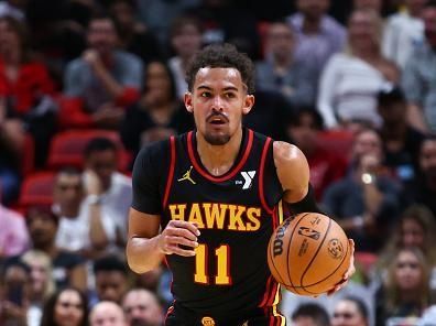 MIAMI, FLORIDA - DECEMBER 22: Trae Young #11 of the Atlanta Hawks dribbles the ball against the Miami Heat during the second quarter of the game at Kaseya Center on December 22, 2023 in Miami, Florida. NOTE TO USER: User expressly acknowledges and agrees that, by downloading and or using this photograph, User is consenting to the terms and conditions of the Getty Images License Agreement. (Photo by Megan Briggs/Getty Images)