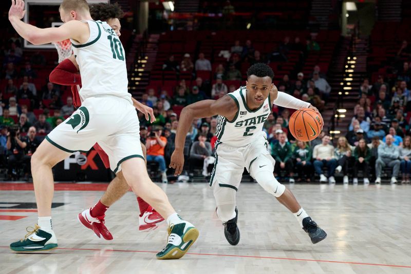 Nov 24, 2022; Portland, Oregon, USA;  Michigan State Spartans guard Tyson Walker (2) drives to the basket during the first half against the Alabama Crimson Tide at Moda Center. Mandatory Credit: Troy Wayrynen-USA TODAY Sports