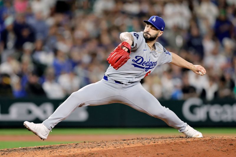 Sep 26, 2025; Seattle, Washington, USA; Los Angeles Dodgers pitcher Tanner Scott (66) throws against the Seattle Mariners during the ninth inning at T-Mobile Park. Mandatory Credit: John Froschauer-Imagn Images