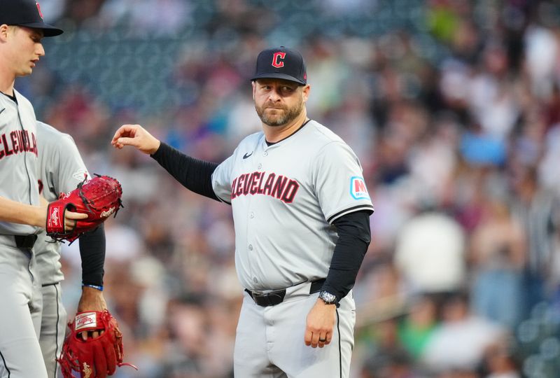 May 29, 2024; Denver, Colorado, USA; Cleveland Guardians manager Stephen Vogt (12) visits the mound in the fifth inning against the Colorado Rockies at Coors Field. Mandatory Credit: Ron Chenoy-USA TODAY Sports