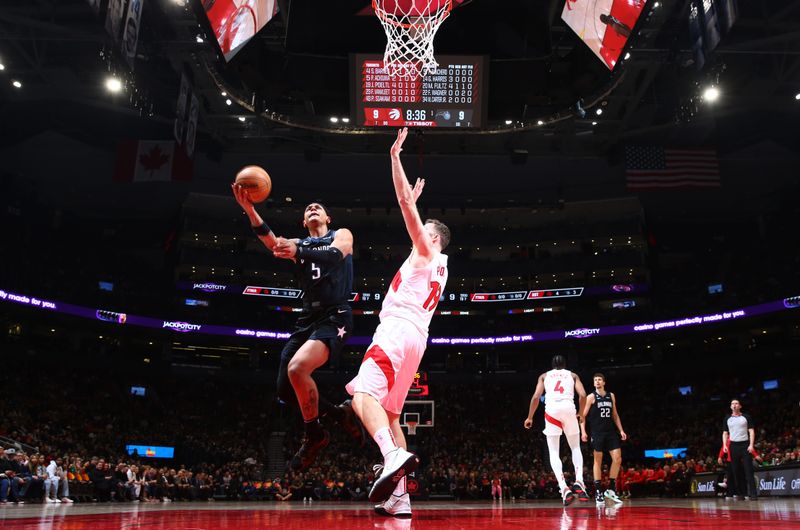 TORONTO, CANADA - FEBRUARY 14:  Paolo Banchero #5 of the Orlando Magic drives to the basket during the game against the Toronto Raptors on February 14, 2023 at the Scotiabank Arena in Toronto, Ontario, Canada.  NOTE TO USER: User expressly acknowledges and agrees that, by downloading and or using this Photograph, user is consenting to the terms and conditions of the Getty Images License Agreement.  Mandatory Copyright Notice: Copyright 2023 NBAE (Photo by Vaughn Ridley/NBAE via Getty Images)