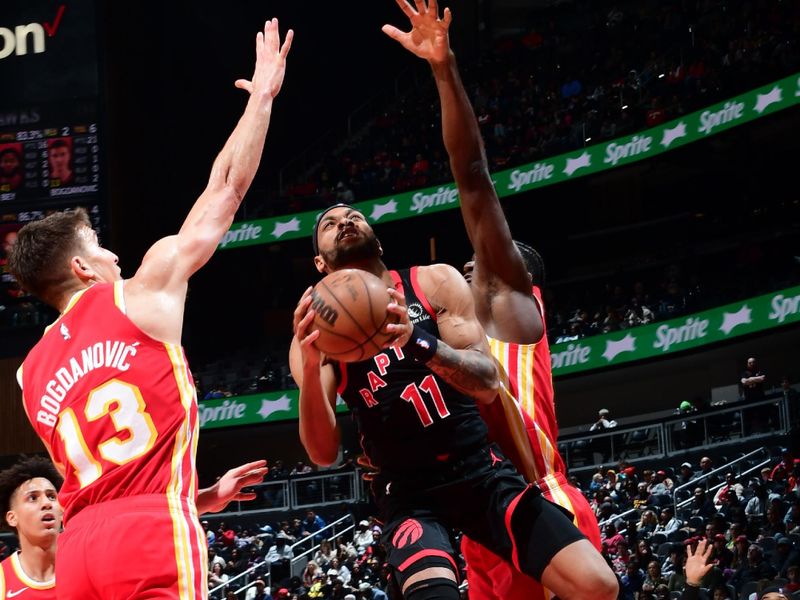 ATLANTA, GA - JANUARY 28: Bruce Brown #11 of the Toronto Raptors drives to the basket during the game against the Atlanta Hawks on January 28, 2024 at State Farm Arena in Atlanta, Georgia.  NOTE TO USER: User expressly acknowledges and agrees that, by downloading and/or using this Photograph, user is consenting to the terms and conditions of the Getty Images License Agreement. Mandatory Copyright Notice: Copyright 2024 NBAE (Photo by Scott Cunningham/NBAE via Getty Images)