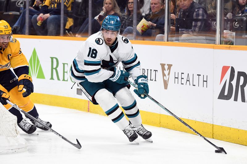 Mar 19, 2024; Nashville, Tennessee, USA; San Jose Sharks right wing Filip Zadina (18) handles the puck behind the net against Nashville Predators defenseman Roman Josi (59) during the second period at Bridgestone Arena. Mandatory Credit: Christopher Hanewinckel-USA TODAY Sports