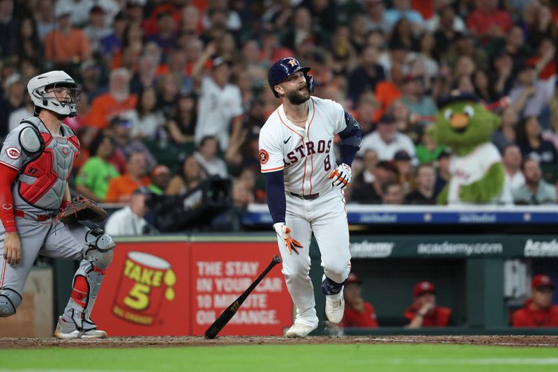 May 10, 2025; Houston, Texas, USA; Houston Astros first baseman Christian Walker (8) hits a triple during the third inning against the Cincinnati Reds at Daikin Park. Mandatory Credit: Troy Taormina-Imagn Images