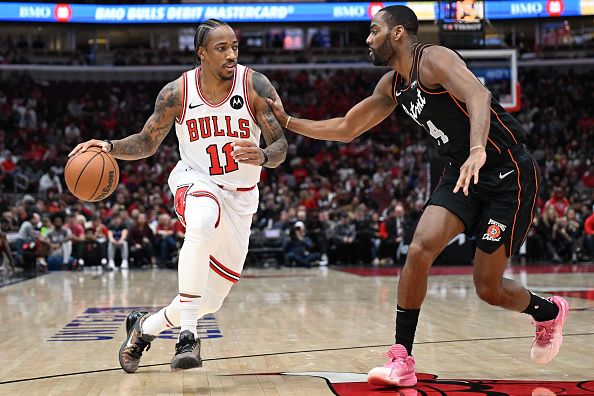 CHICAGO, ILLINOIS - NOVEMBER 12: DeMar DeRozan #11 of the Chicago Bulls drives in the first half against Alec Burks #14 of the Detroit Pistons at the United Center on November 12, 2023 in Chicago, Illinois.  NOTE TO USER: User expressly acknowledges and agrees that, by downloading and or using this photograph, User is consenting to the terms and conditions of the Getty Images License Agreement.  (Photo by Quinn Harris/Getty Images)