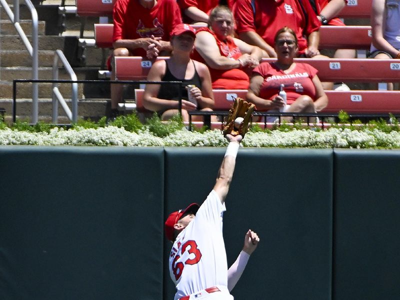 Jun 13, 2024; St. Louis, Missouri, USA;  St. Louis Cardinals center fielder Michael Siani (63) leaps and catches a line drive against the Pittsburgh Pirates during the first inning at Busch Stadium. Mandatory Credit: Jeff Curry-USA TODAY Sports