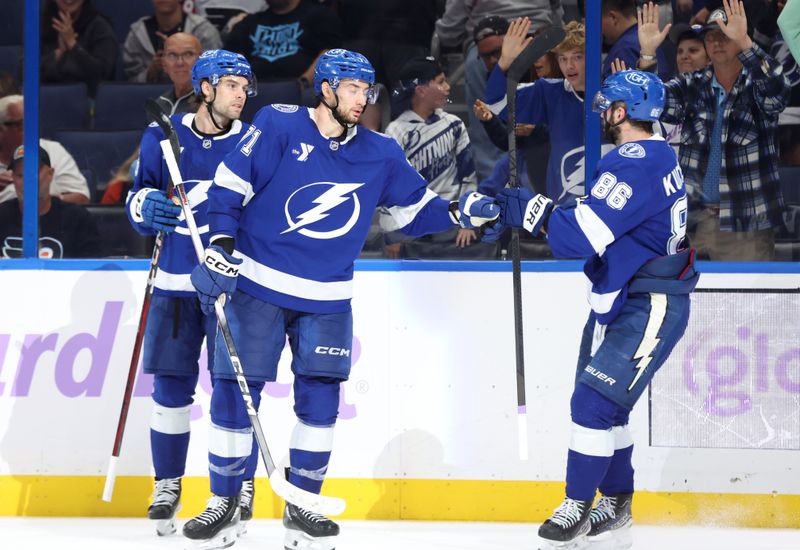 Nov 24, 2025; Tampa, Florida, USA; Tampa Bay Lightning left wing Brandon Hagel (38) is congratulated by center Anthony Cirelli (71) and right wing Nikita Kucherov (86) safter he scored a goal against the Philadelphia Flyers during the third period at Benchmark International Arena. Mandatory Credit: Kim Klement Neitzel-Imagn Images