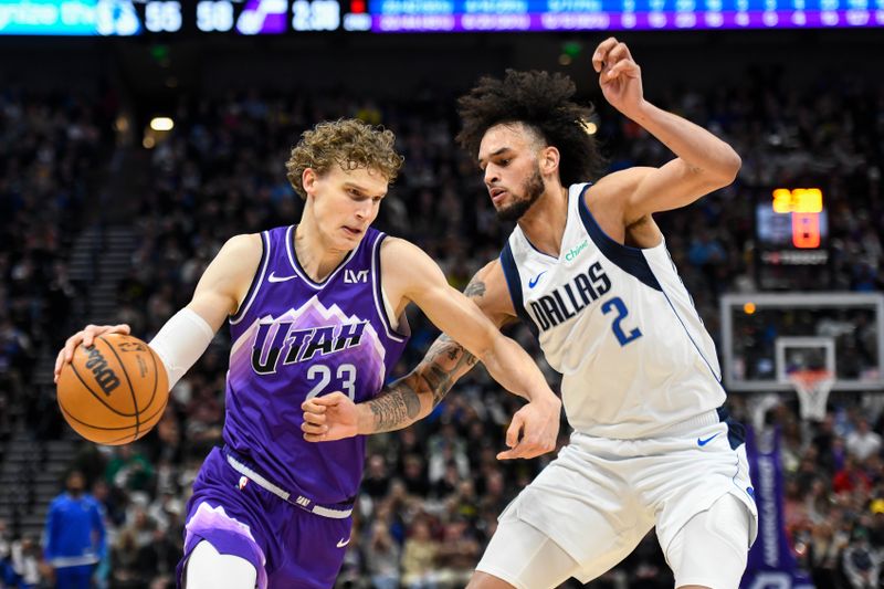 SALT LAKE CITY, UTAH - MARCH 25: Lauri Markkanen #23 of the Utah Jazz drives into Dereck Lively II #2 of the Dallas Mavericks during the first half of a game at Delta Center on March 25, 2024 in Salt Lake City, Utah. NOTE TO USER: User expressly acknowledges and agrees that, by downloading and or using this photograph, User is consenting to the terms and conditions of the Getty Images License Agreement. (Photo by Alex Goodlett/Getty Images)