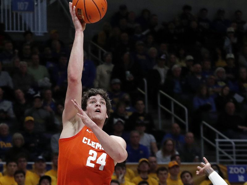 Jan 7, 2023; Pittsburgh, Pennsylvania, USA;  Clemson Tigers center PJ Hall (24) shoots against Pittsburgh Panthers guard Jamarius Burton (11)during the first half at the Petersen Events Center. Mandatory Credit: Charles LeClaire-USA TODAY Sports