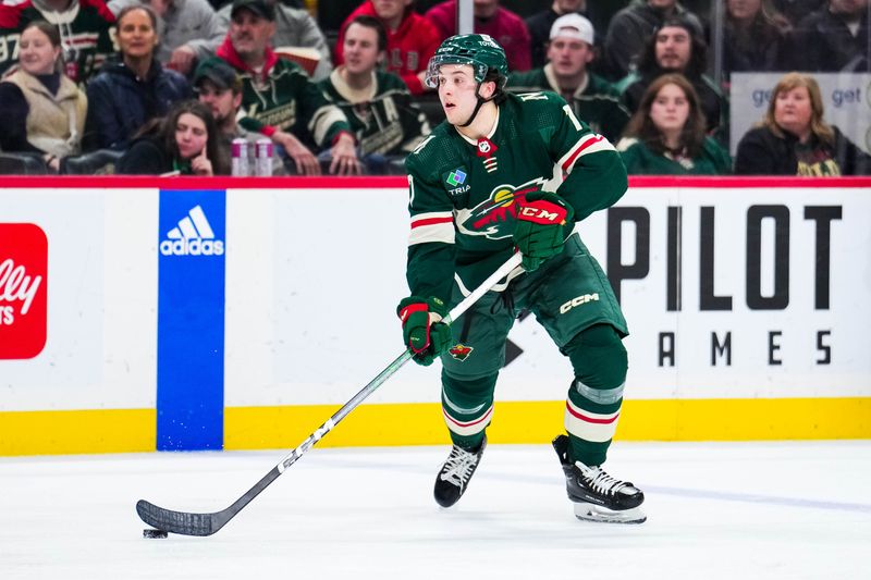 Jan 2, 2024; Saint Paul, Minnesota, USA; Minnesota Wild defenseman Brock Faber (7) looks to pass during the second period against the Calgary Flames at Xcel Energy Center. Mandatory Credit: Brace Hemmelgarn-USA TODAY Sports