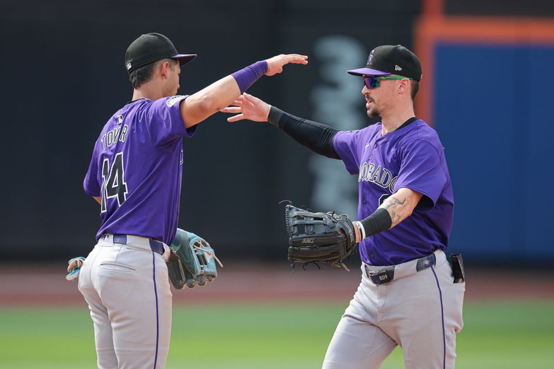 Jul 14, 2024; New York City, New York, USA; Colorado Rockies shortstop Ezequiel Tovar (14) and center fielder Brenton Doyle (9) celebrates after the game against the New York Mets at Citi Field. Mandatory Credit: Vincent Carchietta-USA TODAY Sports