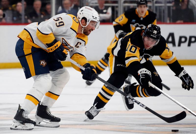 Apr 15, 2024; Pittsburgh, Pennsylvania, USA;  Nashville Predators defenseman Roman Josi (59) moves he puck against Pittsburgh Penguins left wing Drew O'Connor (10) during the third period at PPG Paints Arena. The Penguins won 4-2. Mandatory Credit: Charles LeClaire-USA TODAY Sports