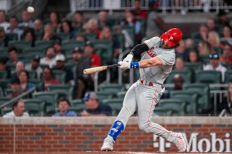 Sep 18, 2023; Cumberland, Georgia, USA; Philadelphia Phillies first baseman Bryce Harper (3) hits a home run against the Atlanta Braves during the third inning at Truist Park. Mandatory Credit: Dale Zanine-USA TODAY Sports