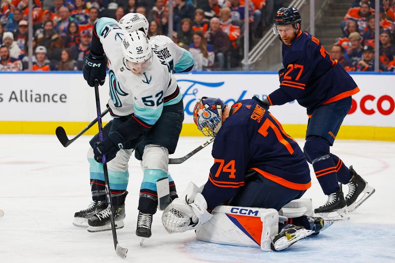 Jan 18, 2024; Edmonton, Alberta, CAN; Seattle Kraken forward Tye Karate (52) looks for a loose puck in front of Edmonton Oilers goaltender Stuart Skinner (74) during the second period at Rogers Place. Mandatory Credit: Perry Nelson-USA TODAY Sports