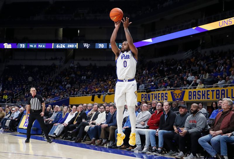 Jan 25, 2023; Pittsburgh, Pennsylvania, USA;  Pittsburgh Panthers guard Nelly Cummings (0) shoots a three point basket against the Wake Forest Demon Deacons during the second half at the Petersen Events Center. Pittsburgh won 81-79. Mandatory Credit: Charles LeClaire-USA TODAY Sports