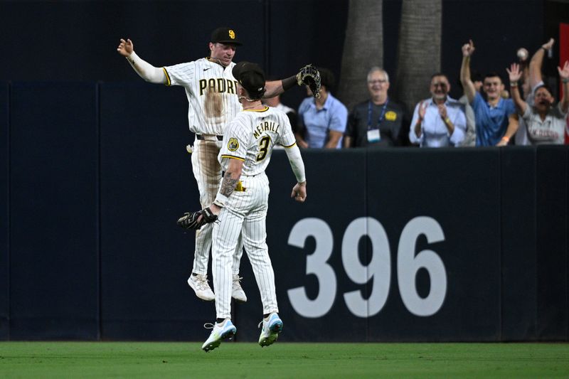 Aug 12, 2024; San Diego, California, USA; San Diego Padres center fielder Jackson Merrill (3) celebrates on the field with right fielder Bryce Johnson (27) after defeating the Pittsburgh Pirates at Petco Park. Mandatory Credit: Orlando Ramirez-USA TODAY Sports