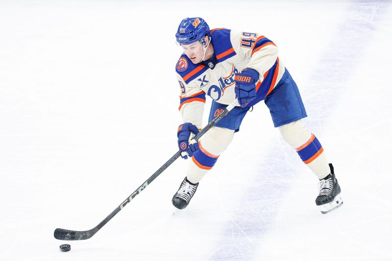 Jan 12, 2026; Chicago, Illinois, USA; Edmonton Oilers defenseman Ty Emberson (49) passes the puck against the Chicago Blackhawks during the second period at United Center. Mandatory Credit: Kamil Krzaczynski-Imagn Images