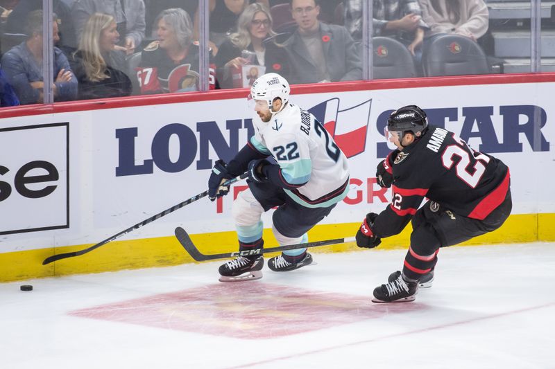 Nov 2, 2024; Ottawa, Ontario, CAN; Seattle Kraken right wing Oliver Bjorkstrand (22) skates with the puck in front of Ottawa Senators right wing Michael Amadio (22) in the third period at the Canadian Tire Centre. Mandatory Credit: Marc DesRosiers-Imagn Images