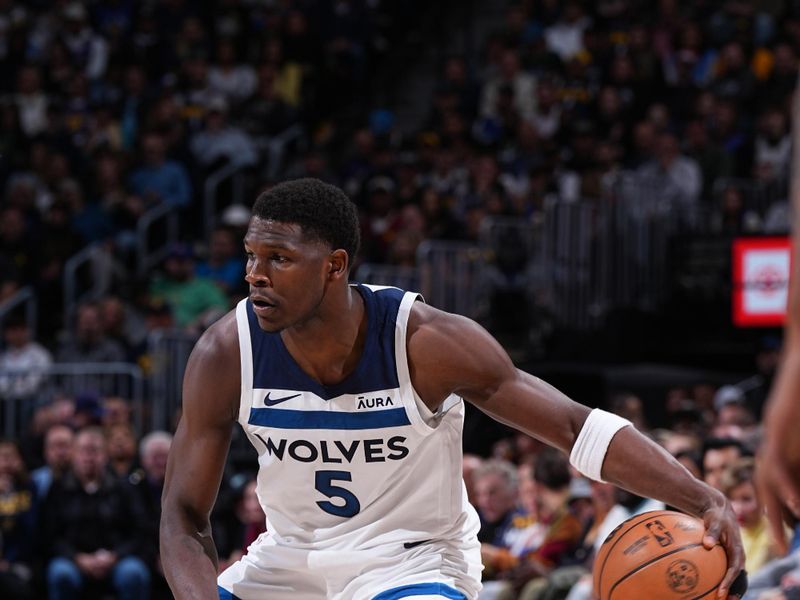 DENVER, CO - APRIL 10: Anthony Edwards #5 of the Minnesota Timberwolves dribbles the ball during the game against the Denver Nuggets on April 10, 2024 at the Ball Arena in Denver, Colorado. NOTE TO USER: User expressly acknowledges and agrees that, by downloading and/or using this Photograph, user is consenting to the terms and conditions of the Getty Images License Agreement. Mandatory Copyright Notice: Copyright 2024 NBAE (Photo by Garrett Ellwood/NBAE via Getty Images)